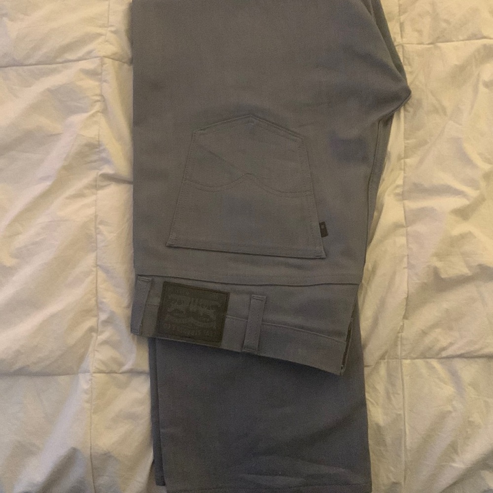 Levi jeans gray in color straight legs size 38/32